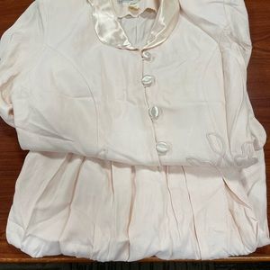 Peach two piece Jessica Howard skirt and jacket.